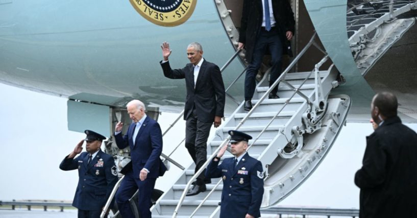 US President Joe Biden and former president Barack Obama step off Air Force One upon arrival at John F. Kennedy International Airport in the Queens borough of New York City on March 28, 2024.