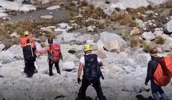 This YouTube screen shot shows authorities in Peru who recovered the body of American mountaineer William Stampfl, who went missing in 2002 in Peru's Huascaran mountain.