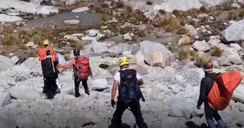 This YouTube screen shot shows authorities in Peru who recovered the body of American mountaineer William Stampfl, who went missing in 2002 in Peru's Huascaran mountain.