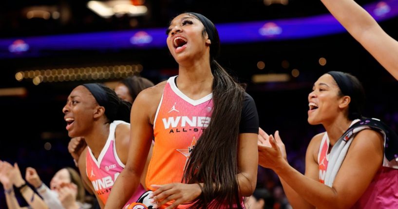 Angel Reese #5 of Team WNBA celebrates during the first half of the 2024 WNBA All-Star game against the USA Basketball Women's National Team at Footprint Center on July 20, 2024 in Phoenix, Arizona.