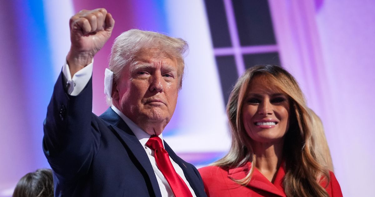 Former first lady Melania Trump joins Republican presidential nominee, former U.S. President Donald Trump on stage after he officially accepted the Republican presidential nomination on the fourth day of the Republican National Convention at the Fiserv Forum on July 18, 2024 in Milwaukee, Wisconsin.