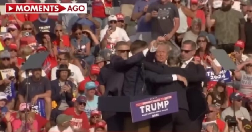 Former President Donald Trump raises his fist in the air after Saturday's shooting in Butler, Pennsylvania.