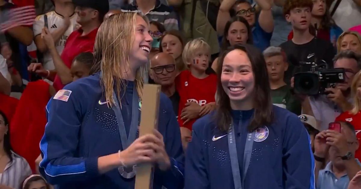 This X screen shot shows Torri Huske, right, and Gretchen Walsh, left, who took home gold and silver, respectively, in the women's 100-meter fly event on July 28.