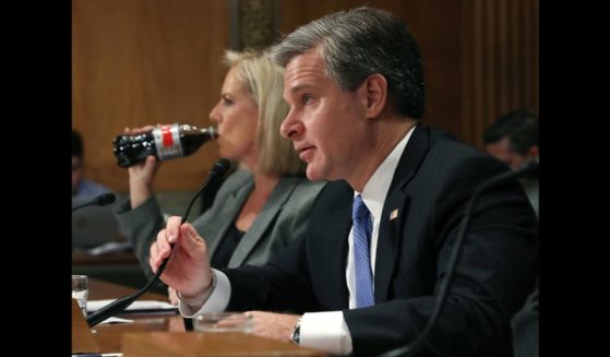 FBI Director Christopher A. Wray testifies alongside Homeland Security Secretary Kirstjen Nielsen during a Senate Homeland Security and Governmental Affairs Committee hearing on Capitol Hill, on October 10, 2018 in Washington, DC.