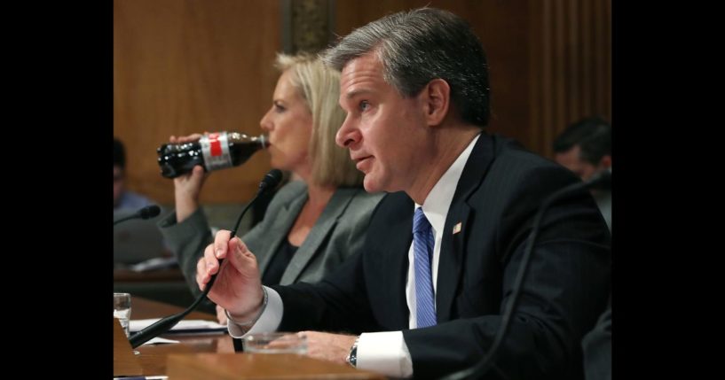 FBI Director Christopher A. Wray testifies alongside Homeland Security Secretary Kirstjen Nielsen during a Senate Homeland Security and Governmental Affairs Committee hearing on Capitol Hill, on October 10, 2018 in Washington, DC.