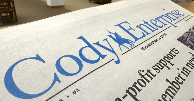 A recent issue of the Cody Enterprise, the Wyoming newspaper where a reporter used artificial intelligence to help write his stories, is seen Tuesday at the Wyoming State Library in Cheyenne.