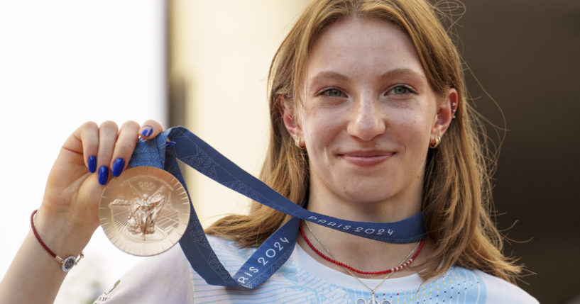 Romanian gymnast Ana Barbosu poses with the bronze medal for her women's artistic gymnastics individual floor performance at the Paris 2024 Olympics, after receiving it during a ceremony at the Romanian Olympic and Sports Committee, in Bucharest, Romania on Friday. American gymnast Jordan Chiles called an arbitration panel's decision that dropped her out of the bronze medal position in the floor exercise at the Paris Olympics "unjust" and a "significant blow" in a message posted on social media Thursday.