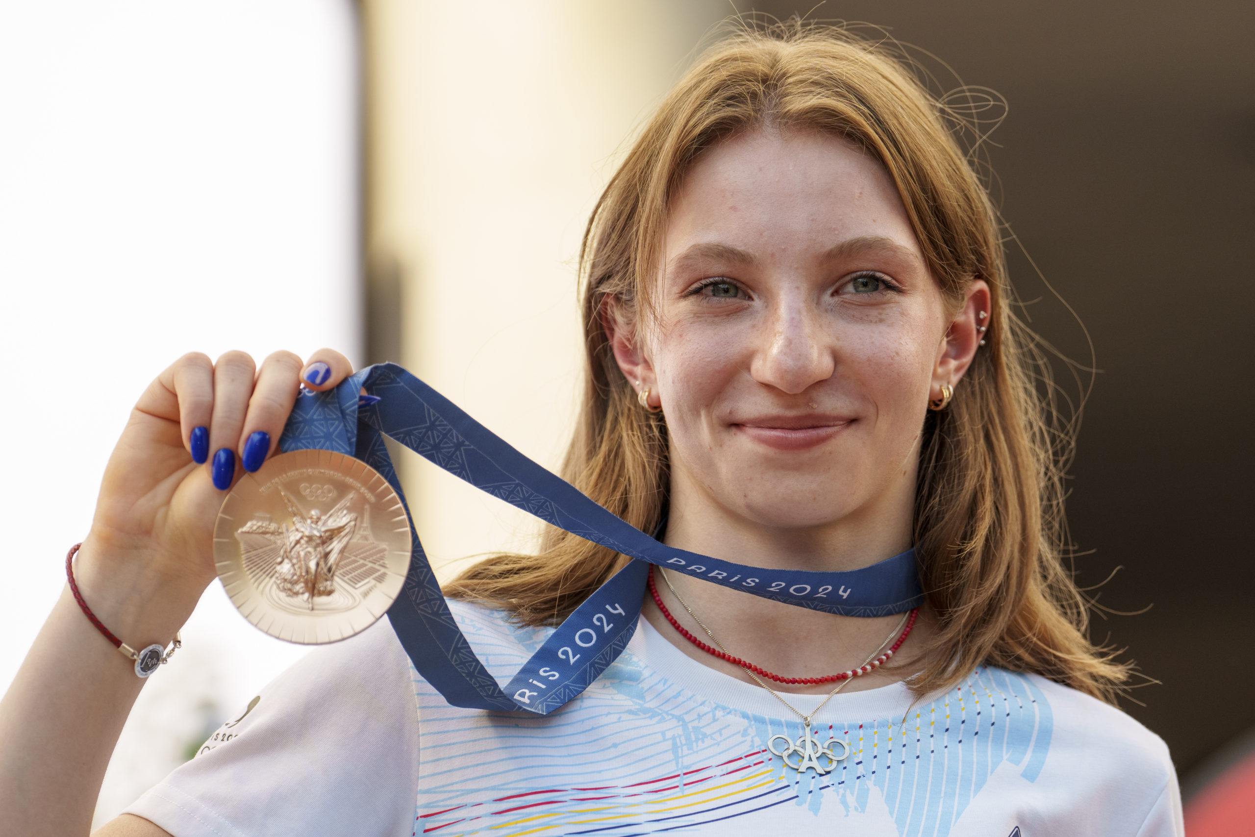 Romanian gymnast Ana Barbosu poses with the bronze medal for her women's artistic gymnastics individual floor performance at the Paris 2024 Olympics, after receiving it during a ceremony at the Romanian Olympic and Sports Committee, in Bucharest, Romania on Friday. American gymnast Jordan Chiles called an arbitration panel's decision that dropped her out of the bronze medal position in the floor exercise at the Paris Olympics "unjust" and a "significant blow" in a message posted on social media Thursday.