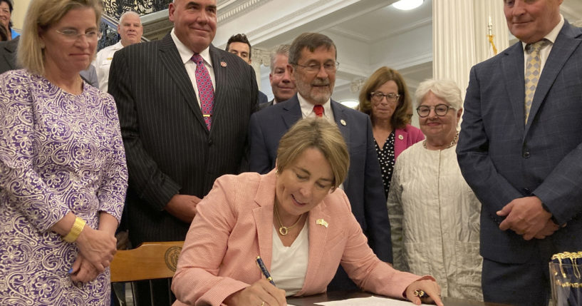 Massachusetts Gov. Maura Healey signs into law a bill that would phase out the use of PFAS, a group of toxic industrial compounds, in firefighters' protective gear, at the Massachusetts Statehouse, Thursday in Boston.