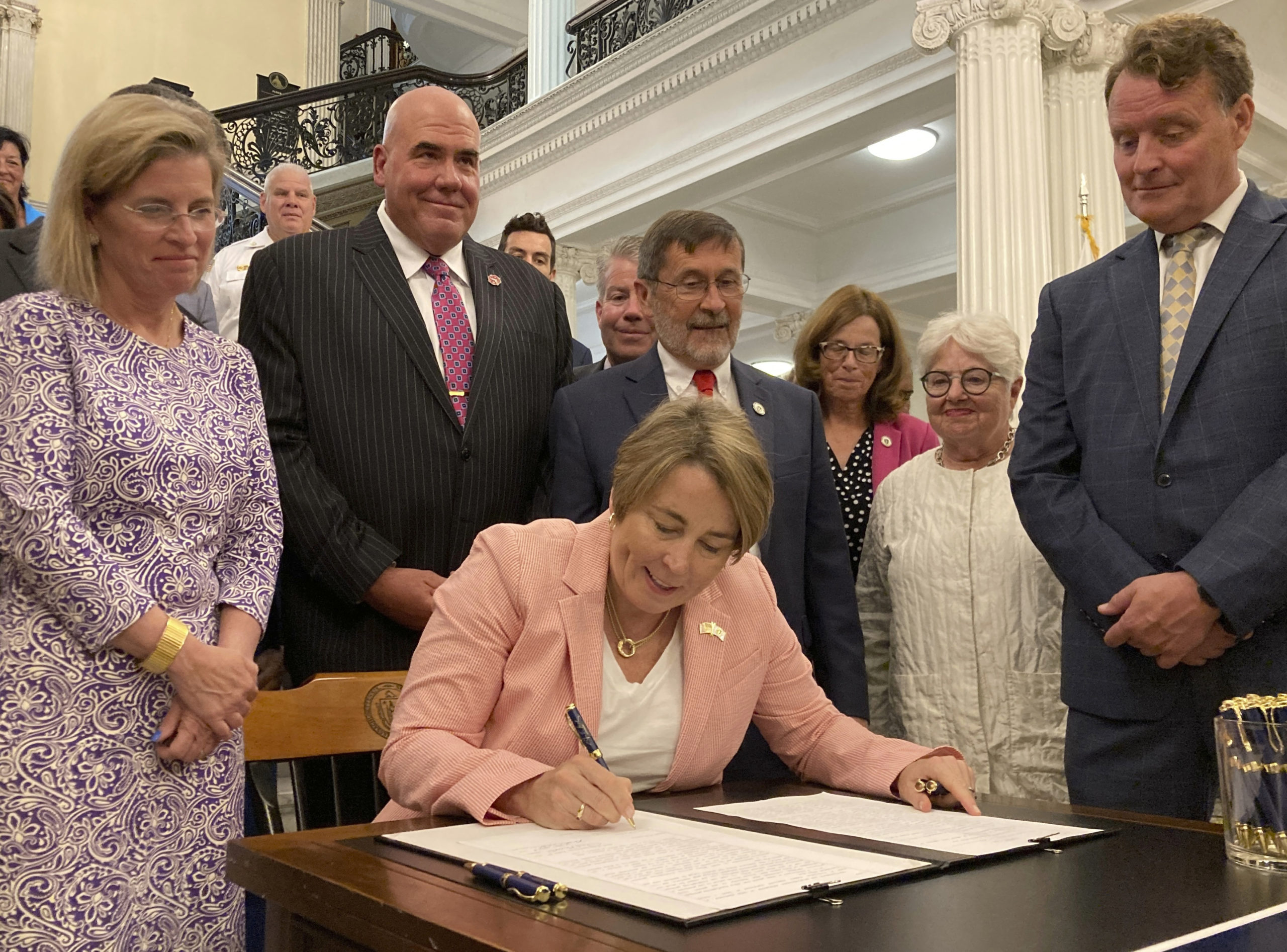 Massachusetts Gov. Maura Healey signs into law a bill that would phase out the use of PFAS, a group of toxic industrial compounds, in firefighters' protective gear, at the Massachusetts Statehouse, Thursday in Boston.