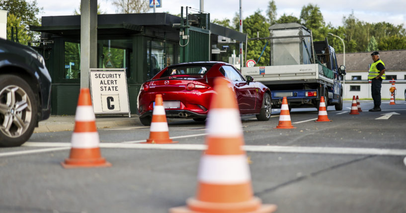 Soldiers check the entrance to the NATO air base, in Geilenkirchen, Germany on Friday, with the security alert state C sign on the left.