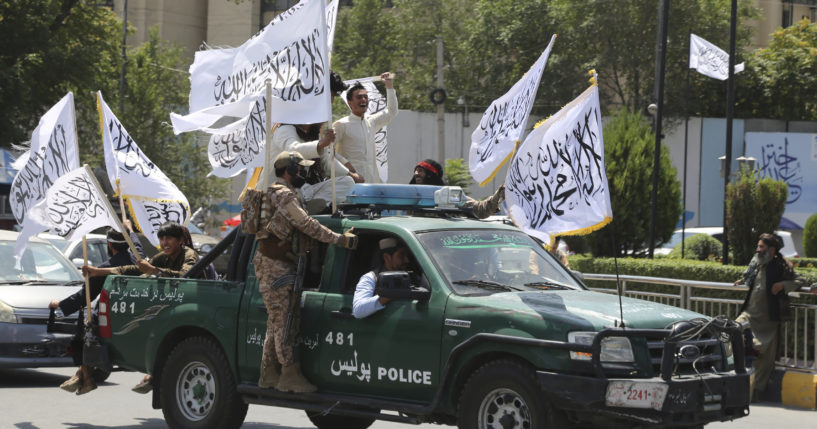 Taliban fighters celebrate the third anniversary of the withdrawal of US-led troops from Afghanistan, in Kabul, Afghanistan on Wednesday, August 14, 2024.