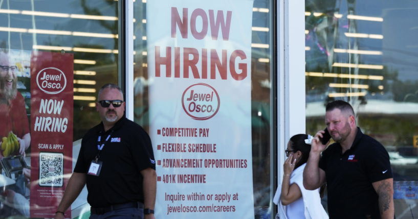 A hiring sign is displayed at a grocery store in Deerfield, Ill., Thursday, July 25, 2024. On Thursday, Aug. 1, 2024, the Labor Department reports on the number of people who applied for unemployment benefits last week.