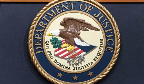 The Department of Justice seals is seen during a news conference at the DOJ office in Washington, May 16, 2023.