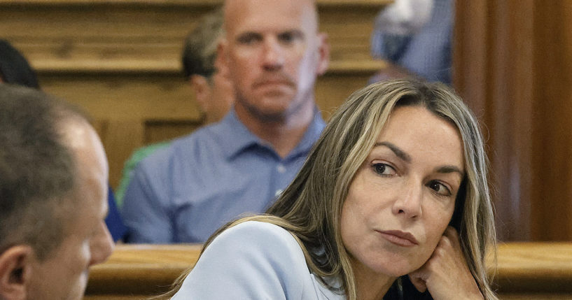 Karen Read listens to her attorney, Martin Weinberg, who was making motions to dismiss two charges against her, at Norfolk Superior Court, in Dedham, Massachusetts, Friday, August 9, 2024.