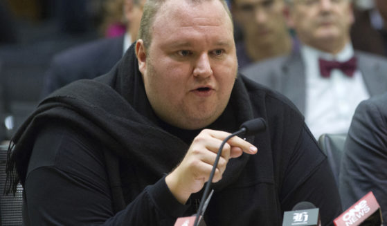 Internet entrepreneur Kim Dotcom speaks during the Intelligence and Security select committee hearing at Parliament, on July 3, 2013, in Wellington, New Zealand.