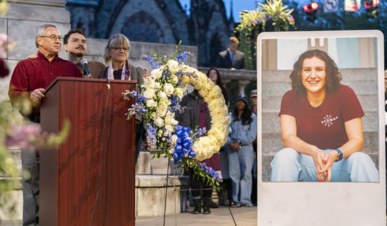 Frank LaPere, Nico LaPere and Caroline Frank, the family of Pava LaPere, founder of tech startup EcoMap Technologies, speak during a vigil in Baltimore, Maryland, on Sept. 27, 2023.