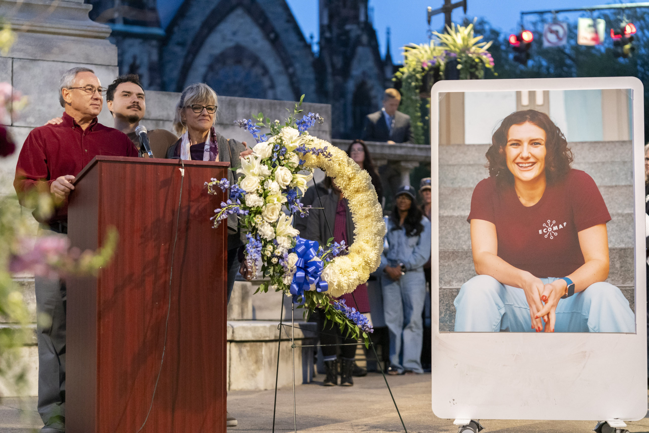 Frank LaPere, Nico LaPere and Caroline Frank, the family of Pava LaPere, founder of tech startup EcoMap Technologies, speak during a vigil in Baltimore, Maryland, on Sept. 27, 2023.