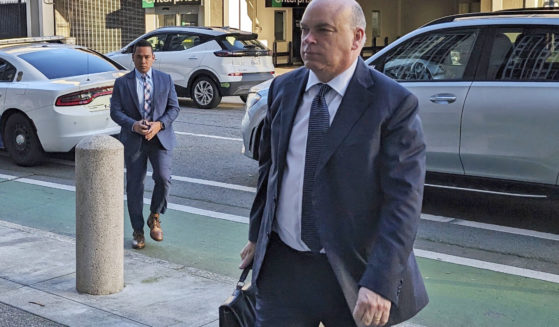 British tech magnate Mike Lynch walks into federal court in San Francisco, on March 26.