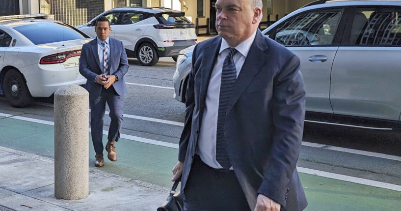 British tech magnate Mike Lynch walks into federal court in San Francisco, on March 26.