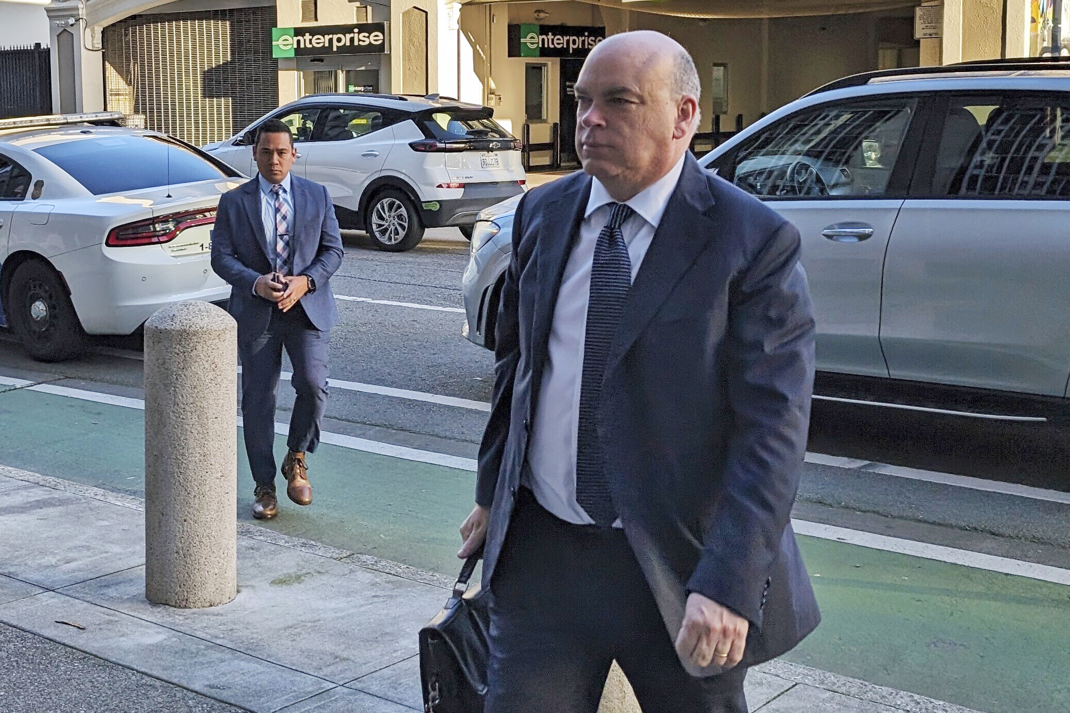 British tech magnate Mike Lynch walks into federal court in San Francisco, on March 26.