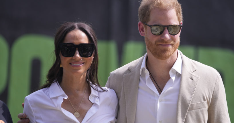 Prince Harry, right, and Meghan attend the Giant of Africa Foundation at the Dream Big Basketball clinic in Lagos Nigeria, on May 12.