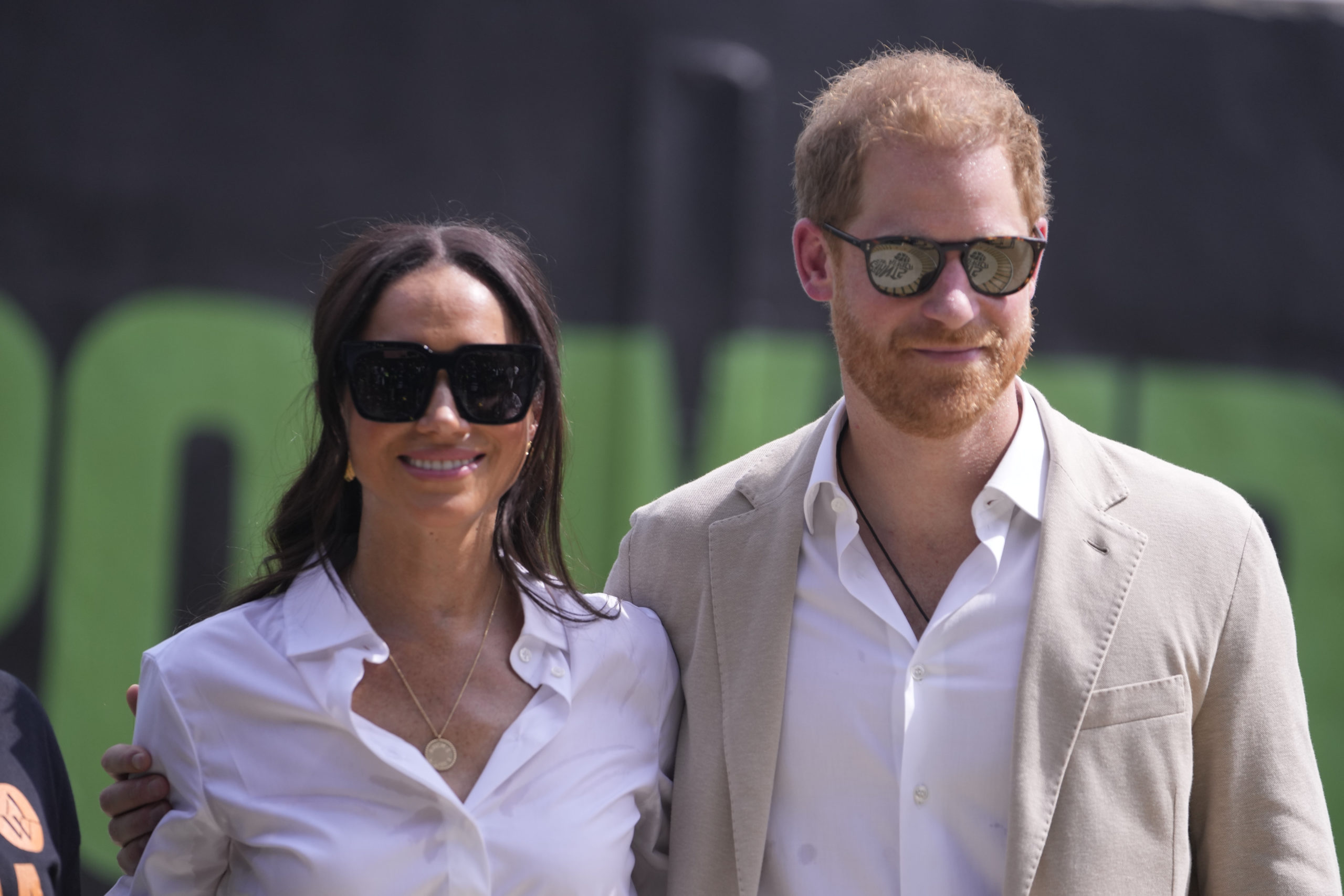 Prince Harry, right, and Meghan attend the Giant of Africa Foundation at the Dream Big Basketball clinic in Lagos Nigeria, on May 12.