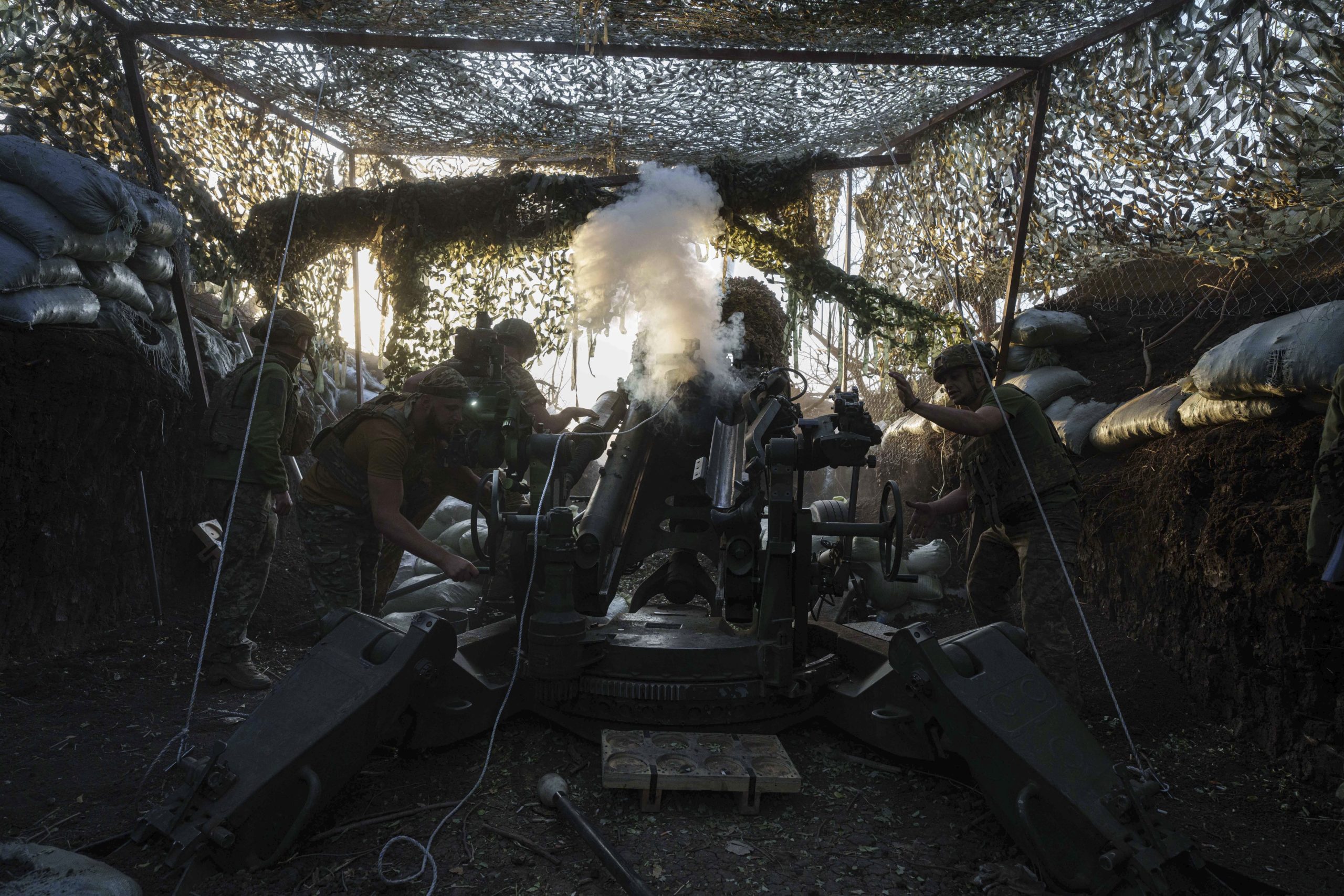 Ukrainian servicemen of 148th separate artillery brigade of the Air Assault Forces fire towards Russian positions by a M777 howitzer at the frontline in Donetsk region, Ukraine on Wednesday.