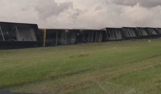 Railroad cars are knocked off the tracks due to high winds Wednesday night, near Steele, North Dakota, on Thursday.