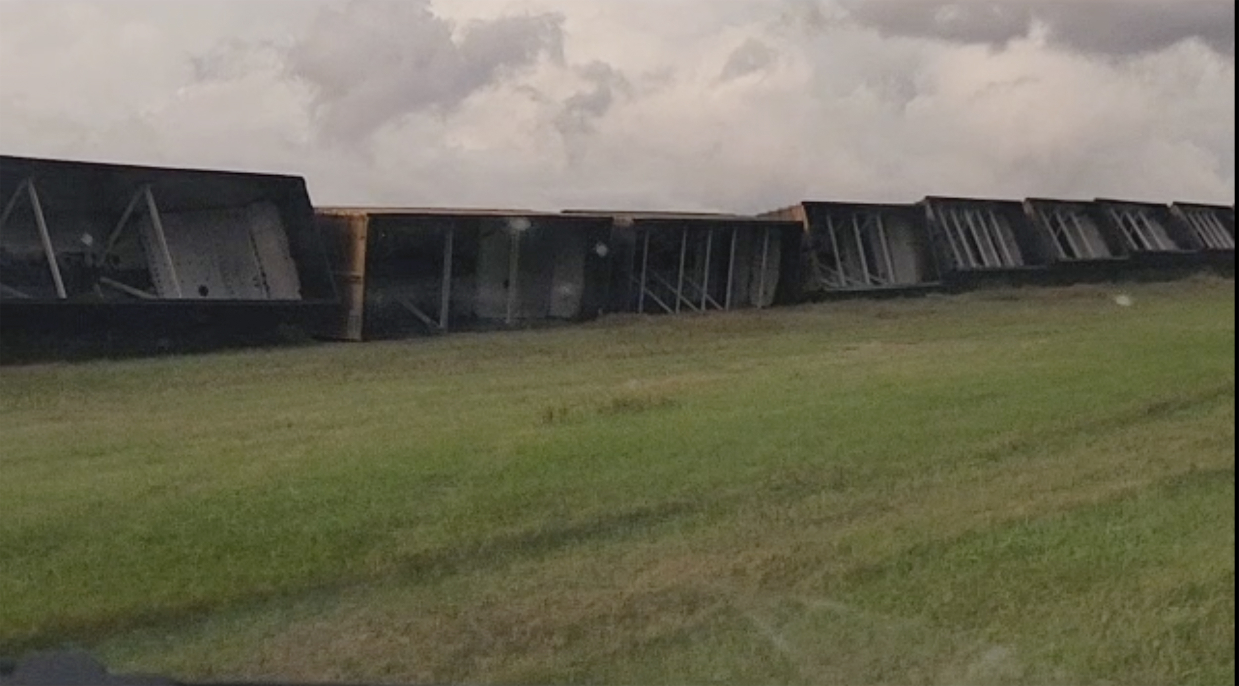 Railroad cars are knocked off the tracks due to high winds Wednesday night, near Steele, North Dakota, on Thursday.