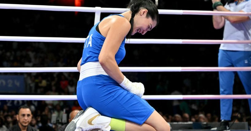 Italian boxer Angela Carini drops to her knees in tears after withdrawing from her match against Algerian boxer Imane Khelif in the Paris Olympics on Thursday.