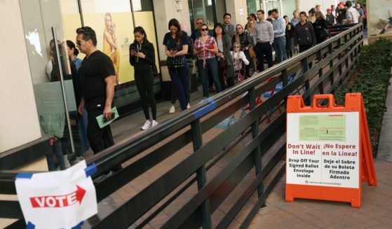 Voters wait to cast their ballots at the Biltmore Fashion Park in Phoenix, Arizona, on Nov. 8, 2022.