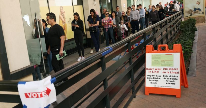 Voters wait to cast their ballots at the Biltmore Fashion Park in Phoenix, Arizona, on Nov. 8, 2022.