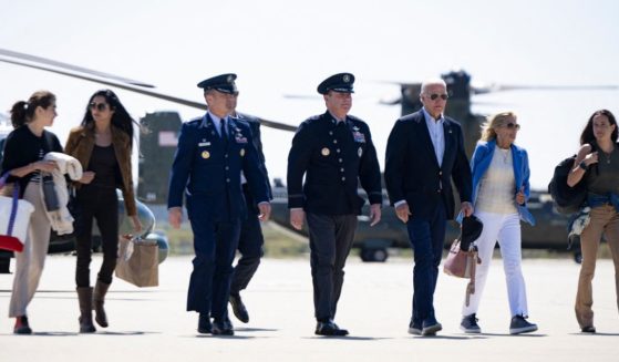 President Joe Biden, first lady Jill Biden, and family members walk from Marine One to Air Force One at Vandenberg Space Force Base in California on Sunday to travel to Delaware for vacation.