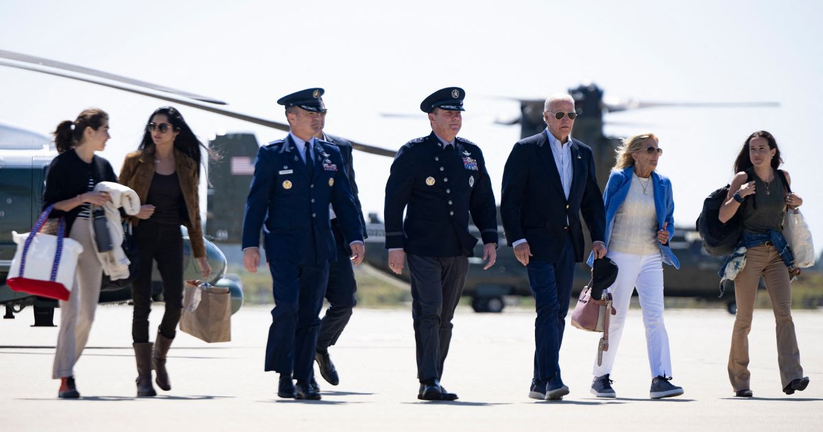 President Joe Biden, first lady Jill Biden, and family members walk from Marine One to Air Force One at Vandenberg Space Force Base in California on Sunday to travel to Delaware for vacation.