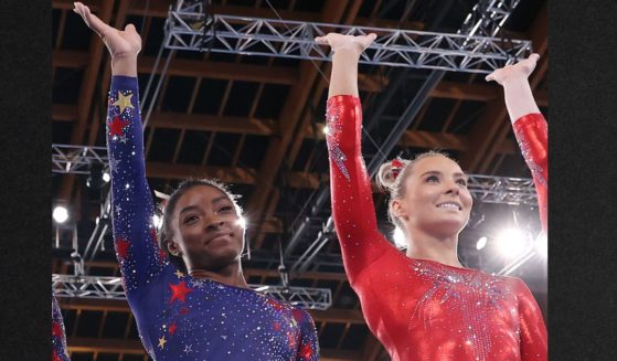 Gymnast Simone Biles, left, defended her social media digs at former Team USA Mykayla Skinner, right, seen at the Tokyo 2020 Olympic Games in Japan. Biles told People she is demonstrating "power" for her younger teammates. Meanwhile, Skinner has published online pleas for Biles to ask her followers to stop threatening Skinner and her family over comments made in an earlier interview over the 2024 team's work ethic.