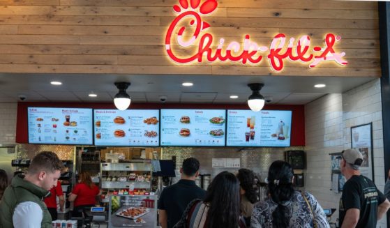 Customers stand in line to order food at a Chick-fil-A restaurant in Plattekill, New York, on May 4.