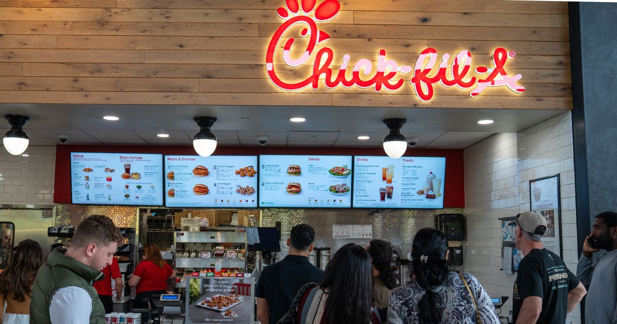 Customers stand in line to order food at a Chick-fil-A restaurant in Plattekill, New York, on May 4.