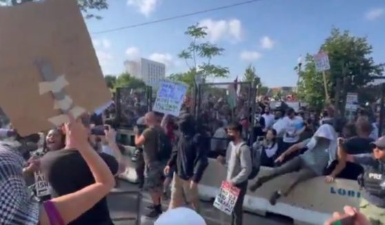 Pro-Palestinian protesters breached the security perimeter around the DNC in Chicago on Monday - taking down part of the perimeter fence.