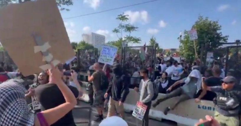 Pro-Palestinian protesters breached the security perimeter around the DNC in Chicago on Monday - taking down part of the perimeter fence.