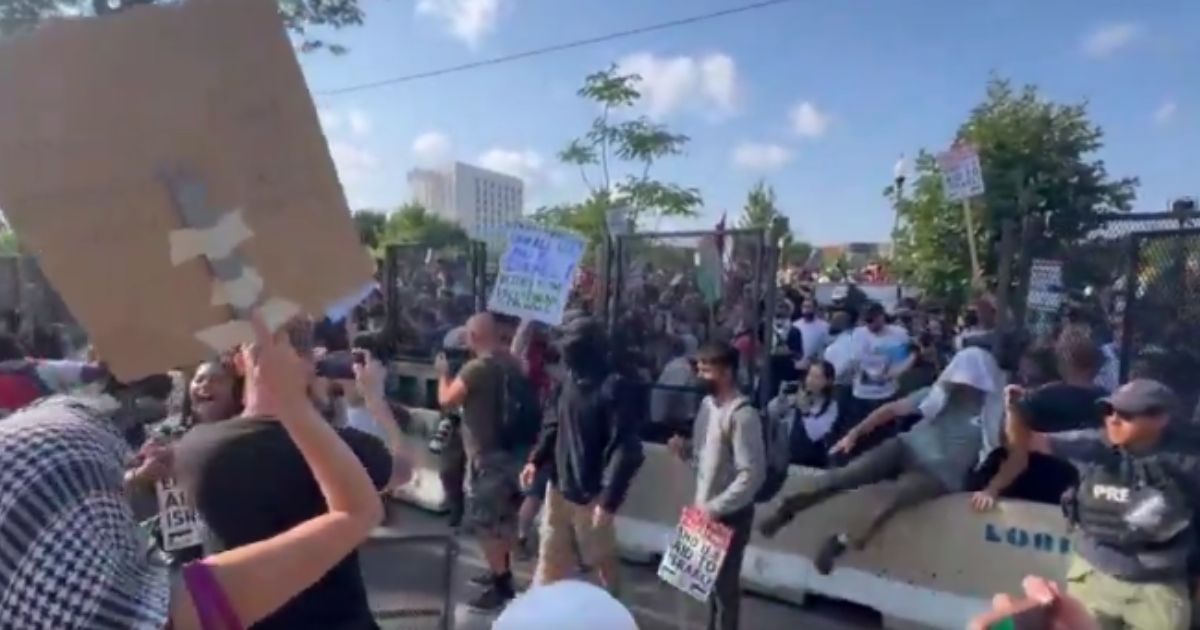 Breaking: Crowd of Angry Far-Left Protesters Breaches DNC, Tears Down Perimeter Fencing