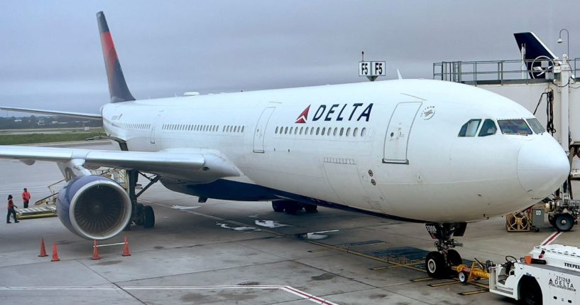 A Delta Airlines airplane sits at a gate at Hartsfield-Jackson Atlanta International Airport in Atlanta, Georgia, in a file photo from Sept. 10, 2022. Two workers were killed and a third injured in an accident at the Delta maintenance facility in Atlanta Tuesday.