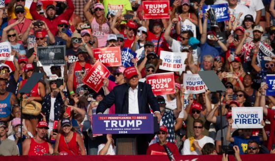 Former President Donald Trump, center, speaks at a campaign rally just moments before being shot by a would-be assassin in Butler, Pennsylvania, on July 13.