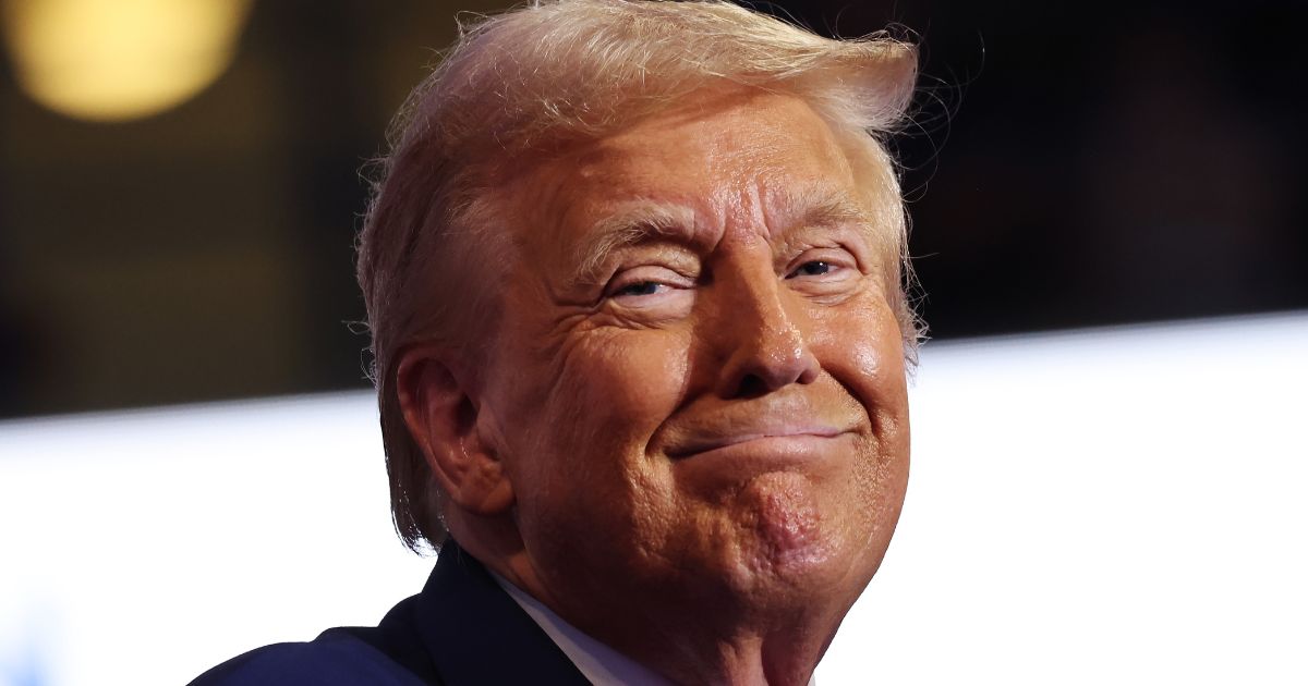 Former President Donald Trump smiles as he pauses during a campaign rally Wilkes Barre, Pennsylvania, on Saturday.