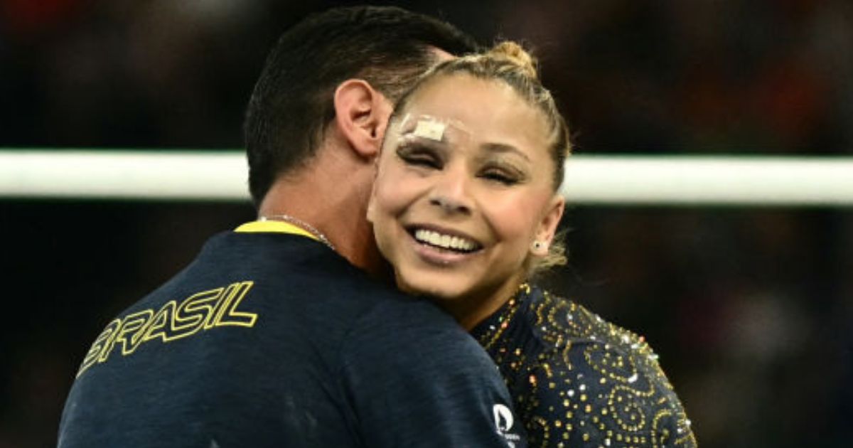 Brazil's Flavia Saraiva reacts with her coach after competing in the uneven bars event of the artistic gymnastics women's team final during the Paris 2024 Olympic Games on July 30.