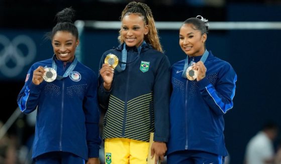 Silver medalist Simone Biles of United States, left, gold medalist Rebeca Andrade of Brazil, center, and bronze medalist Jordan Chiles of the United States, right, display their medals during the medal ceremony after the Women's Floor Exercise Final in Paris, France, on Aug. 5.