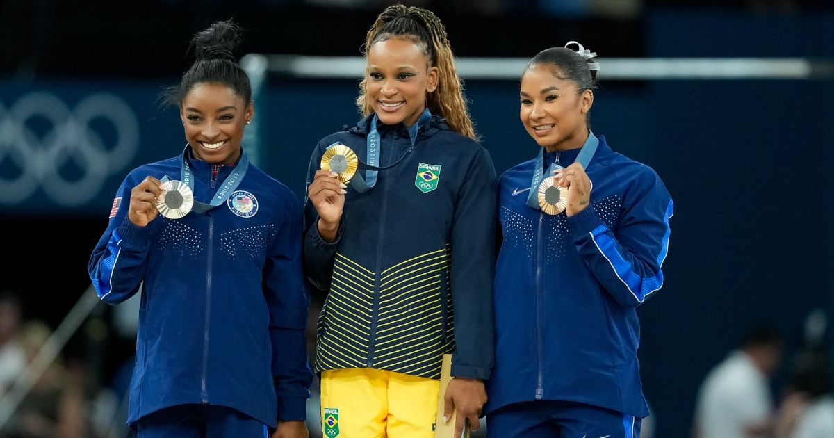 Silver medalist Simone Biles of United States, left, gold medalist Rebeca Andrade of Brazil, center, and bronze medalist Jordan Chiles of the United States, right, display their medals during the medal ceremony after the Women's Floor Exercise Final in Paris, France, on Aug. 5.