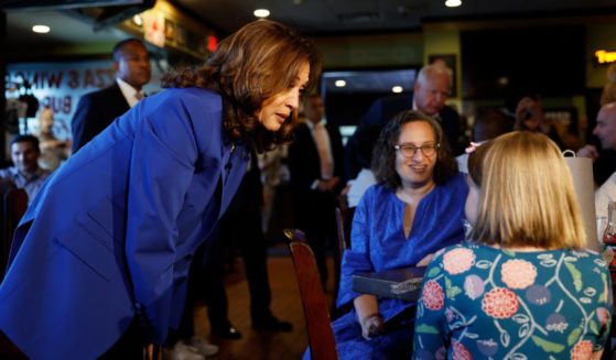 Vice President Kamala Harris speaks people in Primanati Bros. Restaurant in Moon Township, Pennsylvania, on Sunday, but some are accusing her of using paid actors for a photo op in the restaurant.