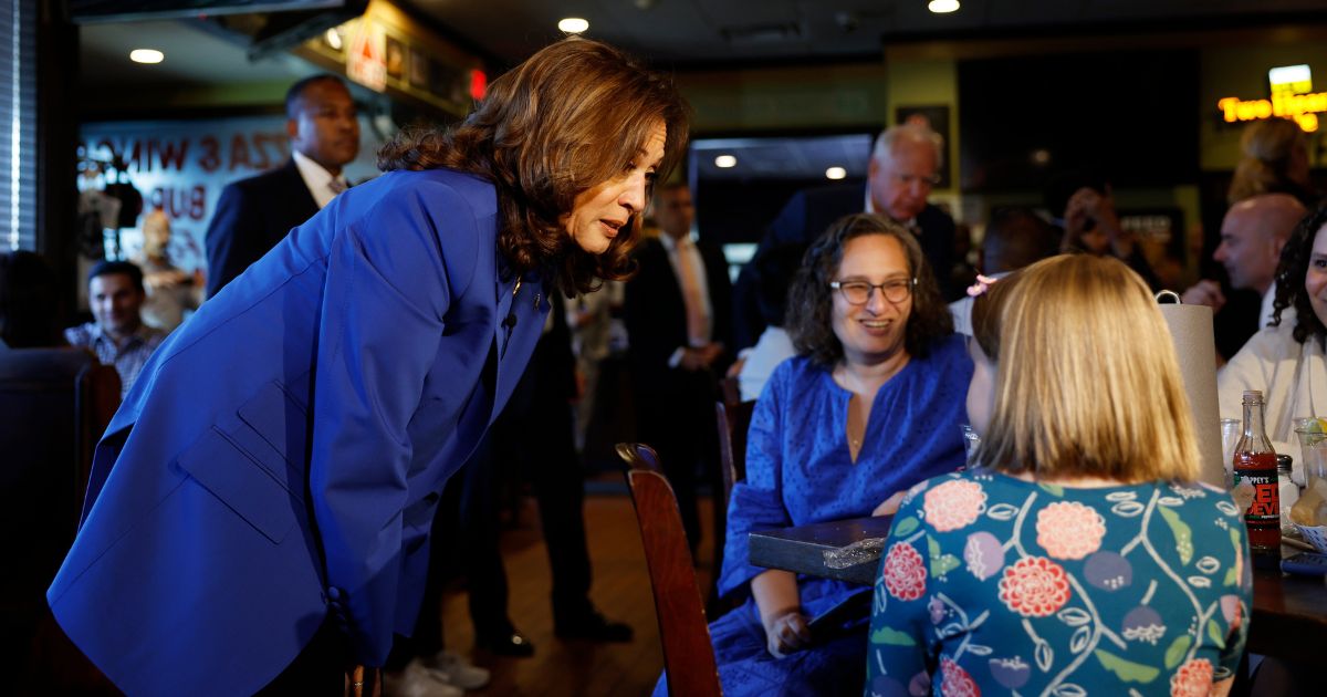 Vice President Kamala Harris speaks people in Primanati Bros. Restaurant in Moon Township, Pennsylvania, on Sunday, but some are accusing her of using paid actors for a photo op in the restaurant.