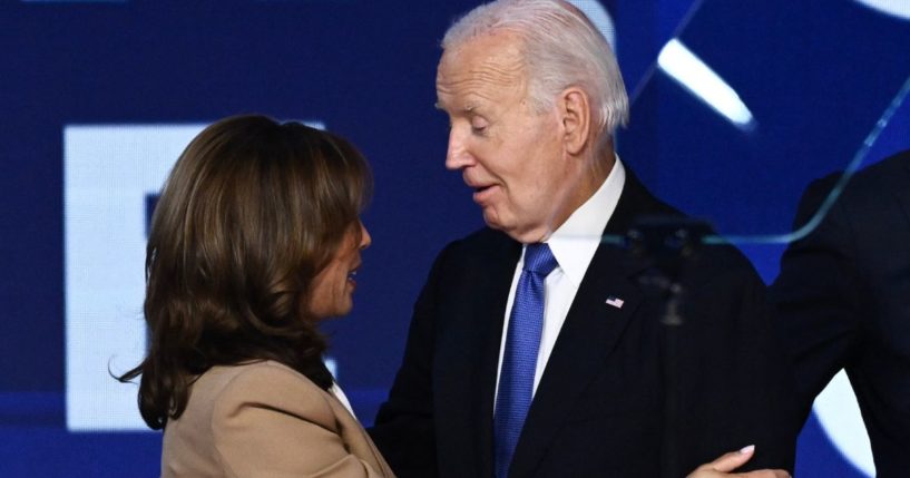 Vice President Kamala Harris, left, and President Joe Biden, right, hug onstage after Biden gave the keynote address on the first day of the Democratic National Convention in Chicago, Illinois, on Aug. 19.